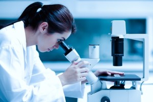 Scientist using a microscope